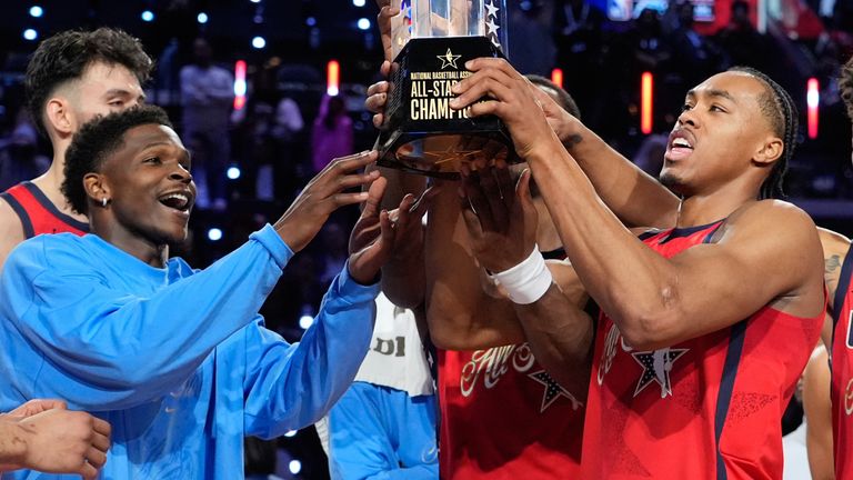 USA Stars lift the championship trophy after their win over USA Stripes in the final 