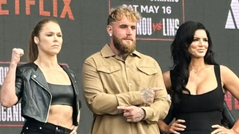 Ronda Rousey, center left, and Gina Carano, right, pose with promoter Jake Paul, center right, during a news conference in Inglewood, Calif., Tuesday, March 10, 2026. (AP Photo/Greg Beacham)