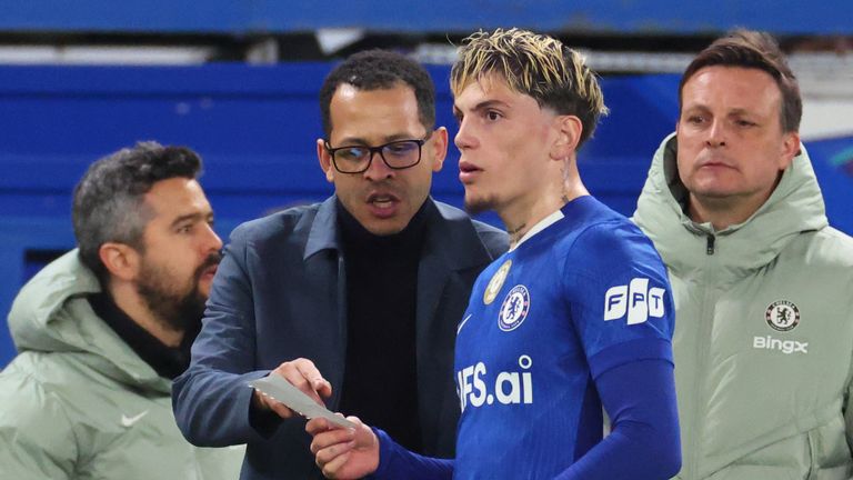 Liam Rosenior passes a note to Alejandro Garnacho late on when Chelsea are down to 10-men against PSG
