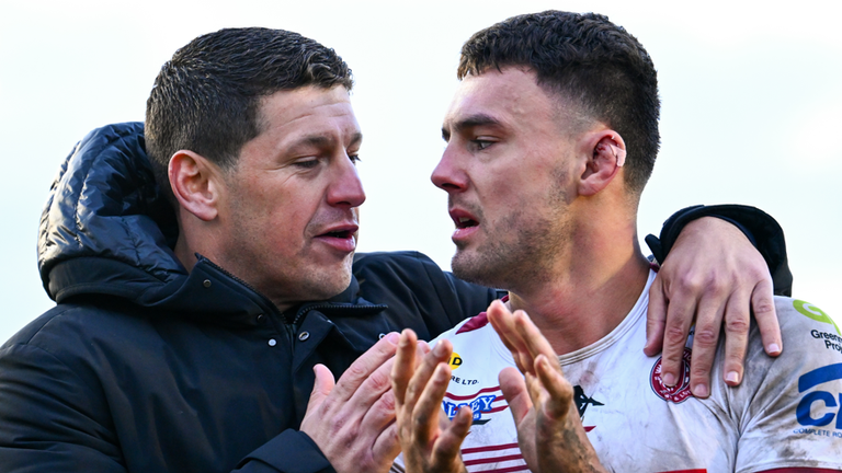 Wigan Warriors Head Coach Matt Peet and Oliver Partington of Wigan celebrates their teams victory over Castleford